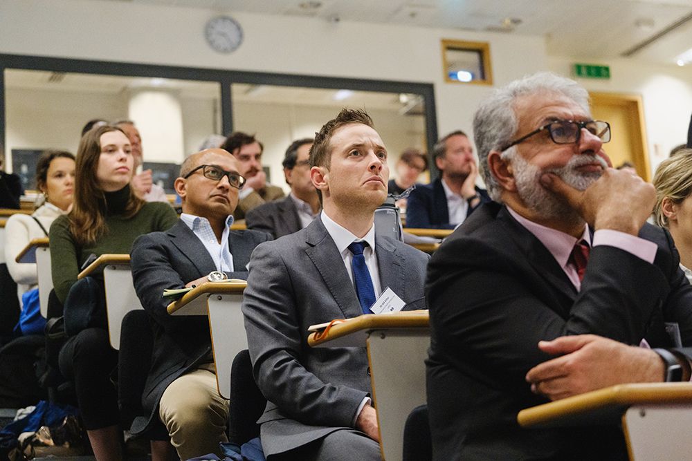 People sit in lecture theatre