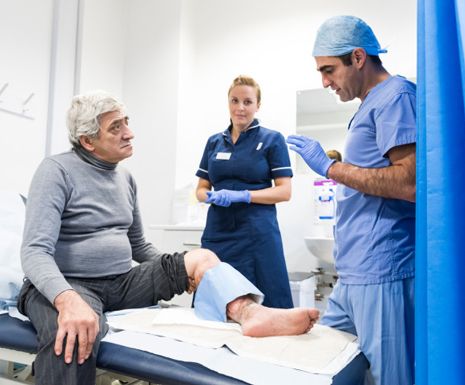 Imperial NHS doctor in appointment with older man