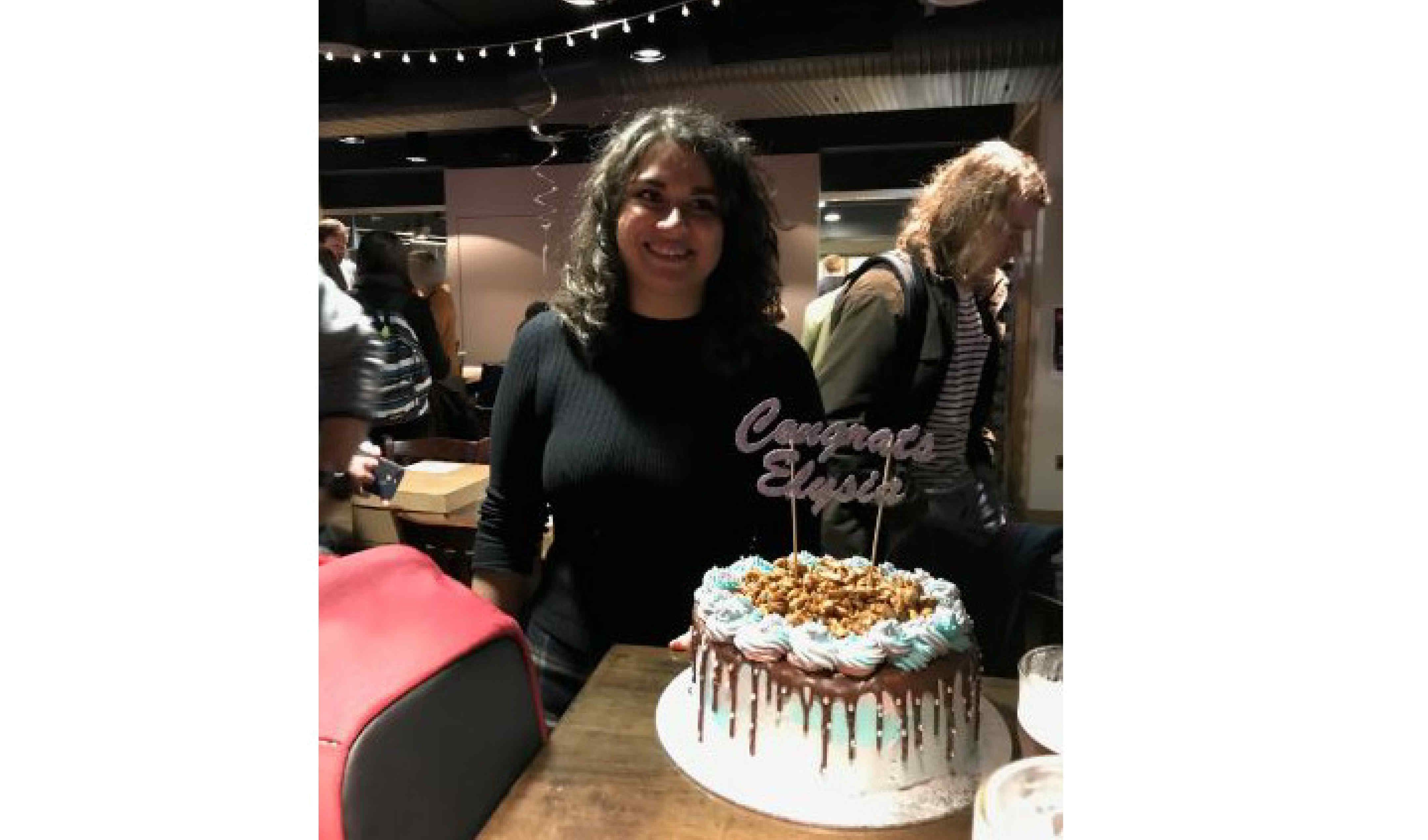 A student with a cake