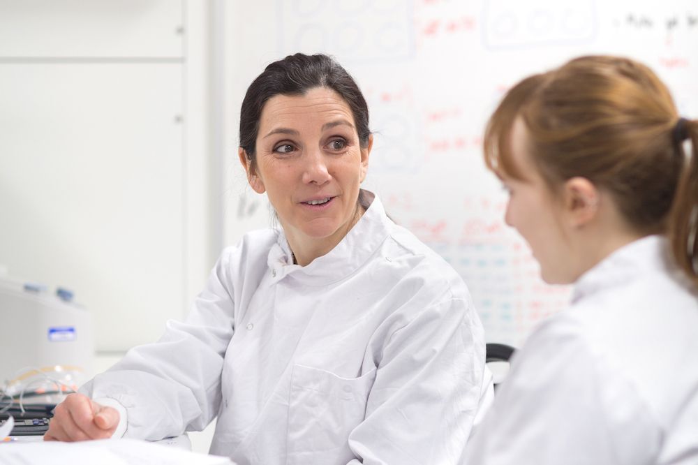 Head of Medical Biosciences programme talking with student.