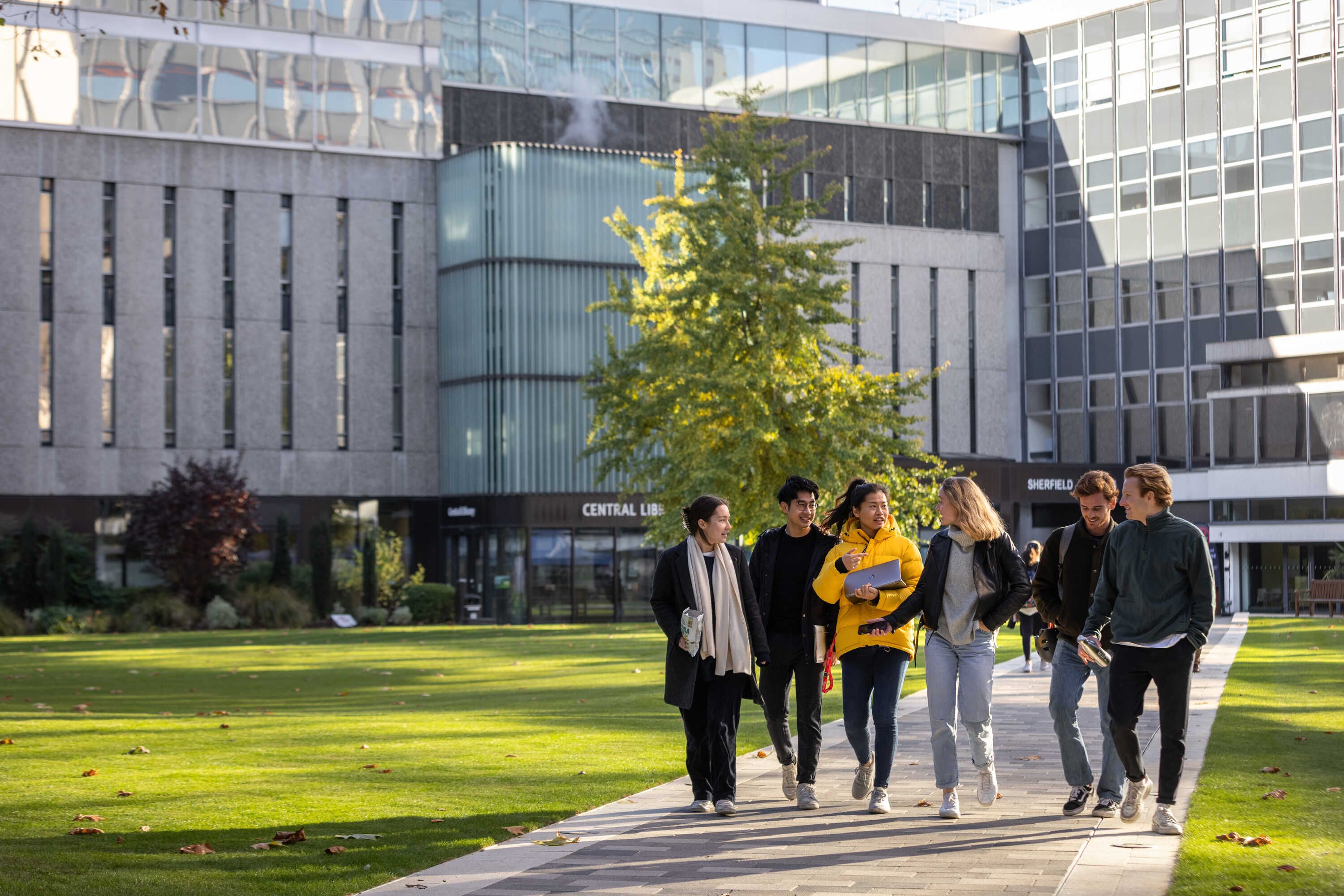 Students walking across Imperial's Dangoor Plaza