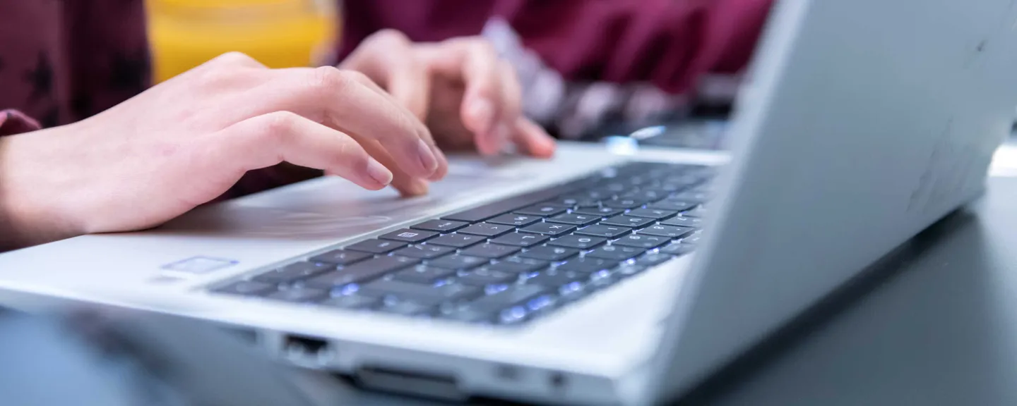 A student using a laptop