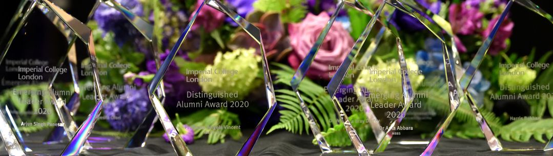 Alumni awards in front of a floral background