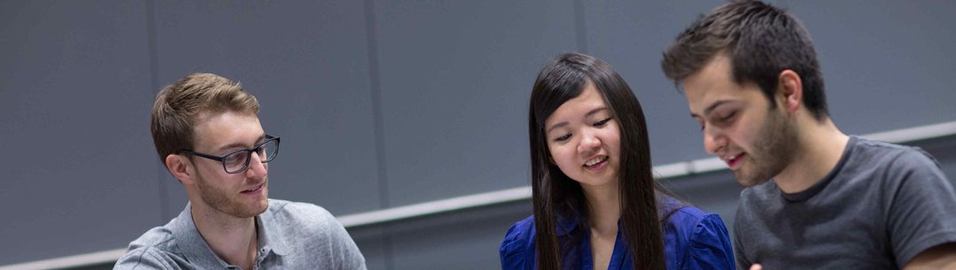 Three students talking