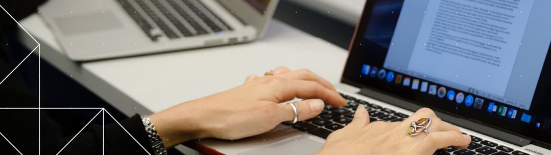 woman typing on laptop