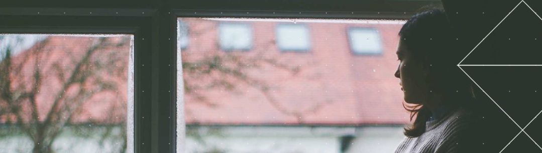 Woman staring outside a window