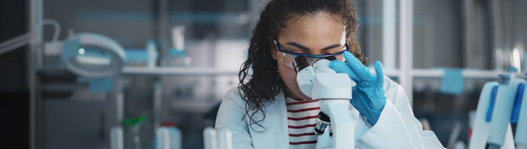 Student using microscope