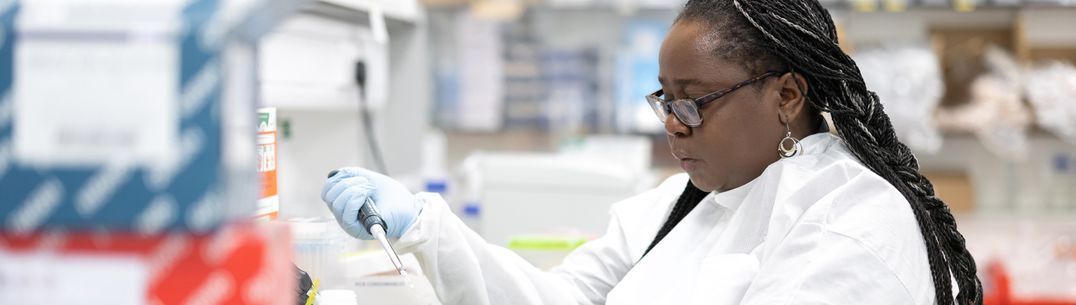 An image of Research Associate, Catherine Kibirige in a laboratory
