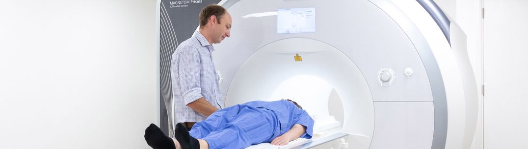 MRI Scan doctor with patient at MRI Scanner