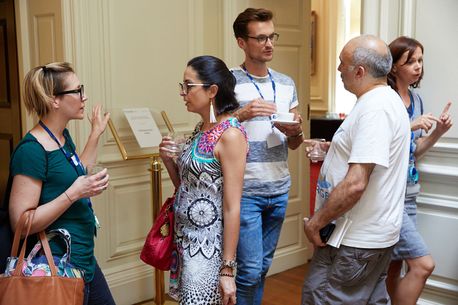 A group of staff in conversation at a staff network event