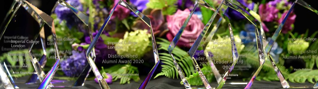 Awards in front of a floral background