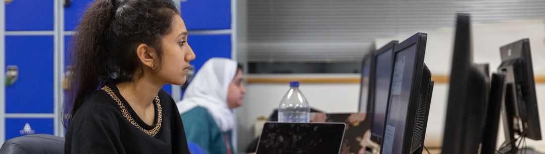 A student working at a computer.