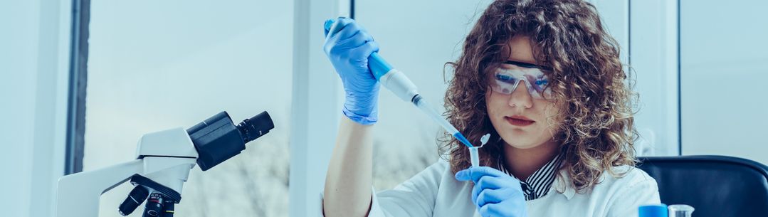 student using a pipette