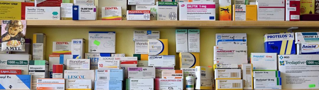 Drugs and vitamins on shelves in a pharmacy