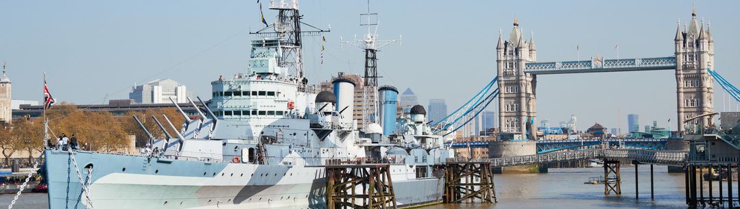 A battleship in front of Tower Bridge in London