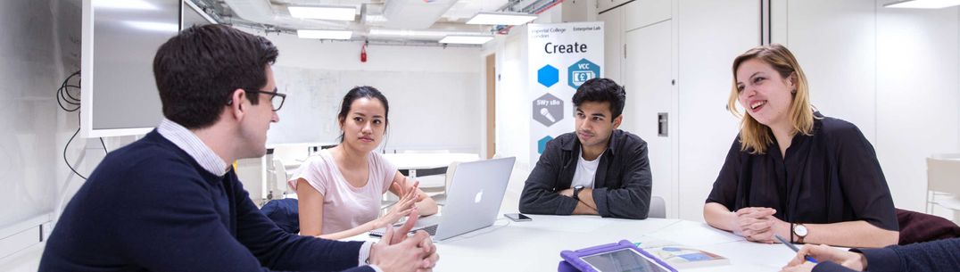 group of students sitting around a table