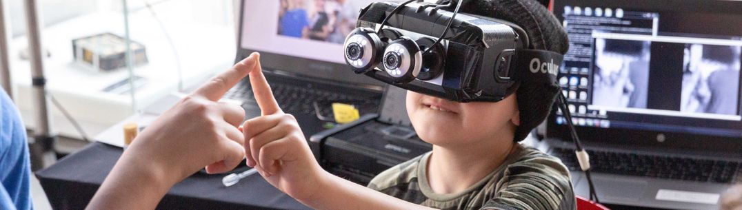 A boy wearing a VR headset