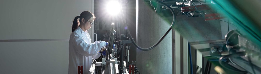 Researcher working on a single-stage gas gun system