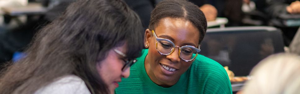 Two women in conversation at the 2024 Diversity onference