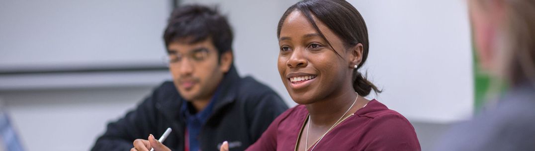 A student takes part in a discussion during a class