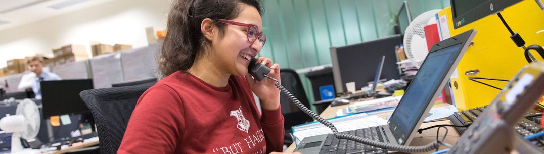 student on a telephone in an office