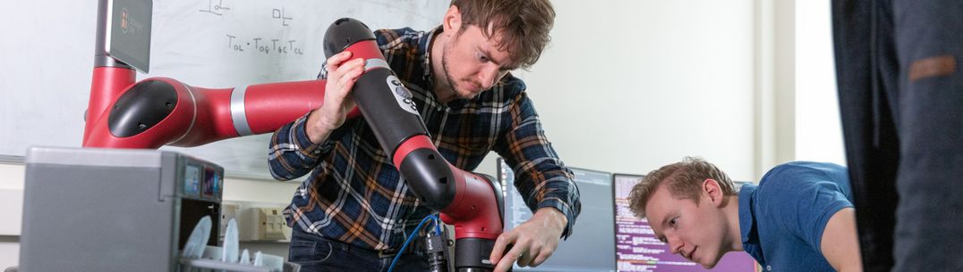 PhD students working on robot simulation, manipulation and learning