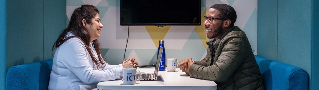 People chat across table