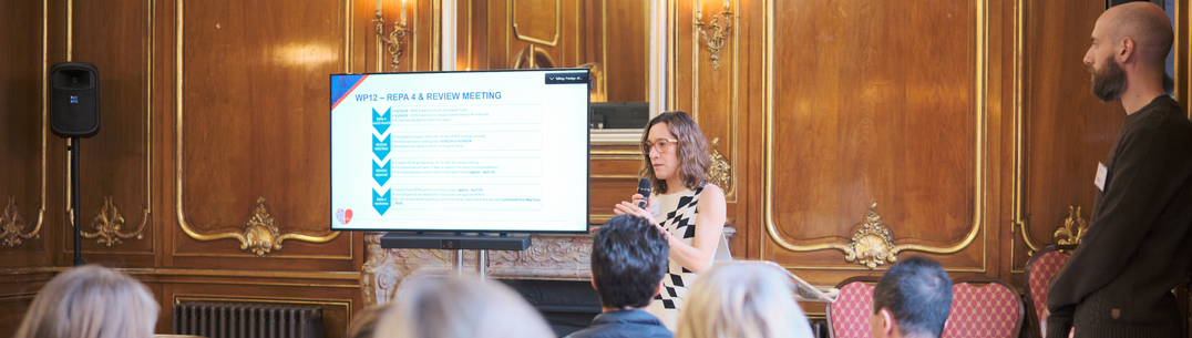 Marta presenting at the front of the room