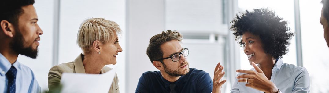 A picture of a group of people in a meeting