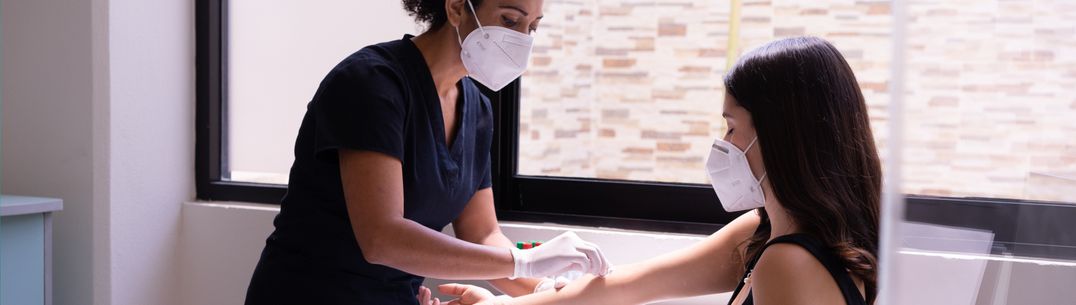 A nurse taking a blood test from a patient