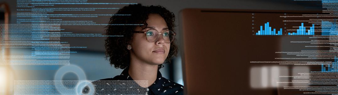 A woman looking at data on a digital screen