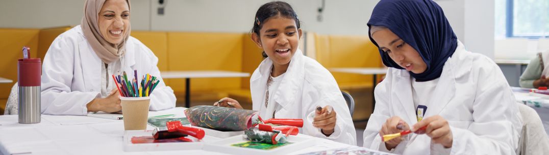 A family take part in a creative STEM workshop at The Invention Rooms