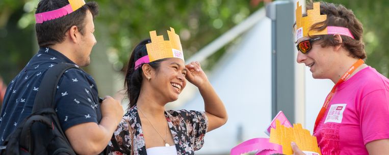 Attendees of the Festival wearing cardboard hats