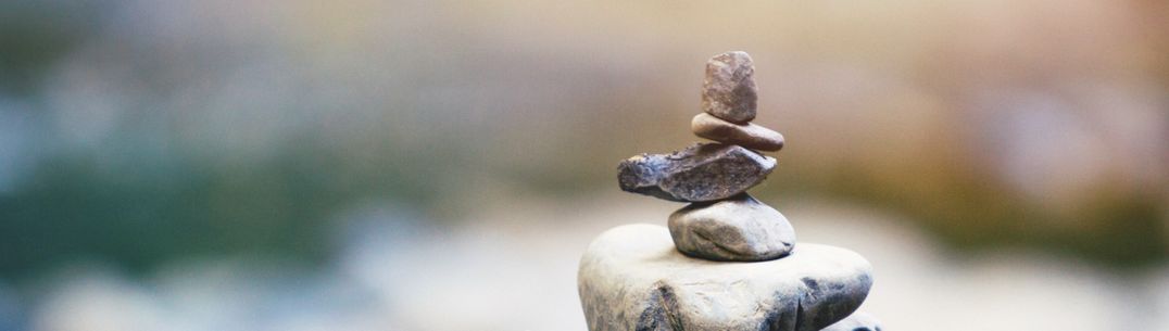 different size pebbles in a tower