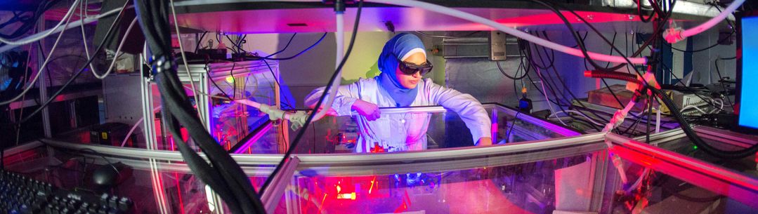 researcher uses machinery in lab