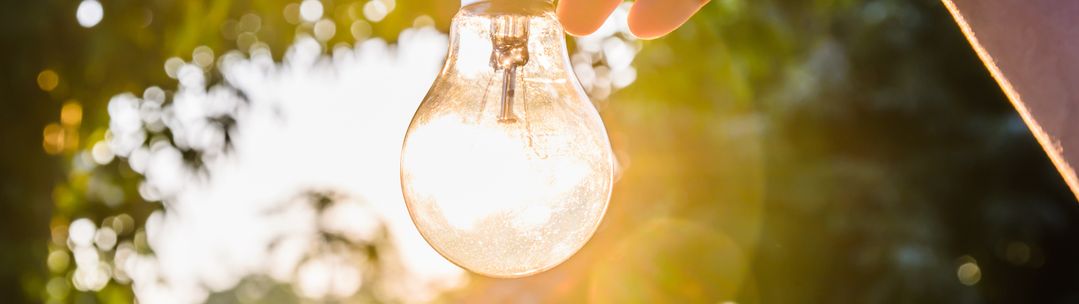 An lightbulb illuminated by sunlight