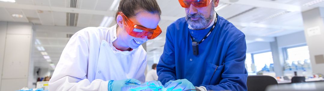 Student and professor conducting research in a laboratory