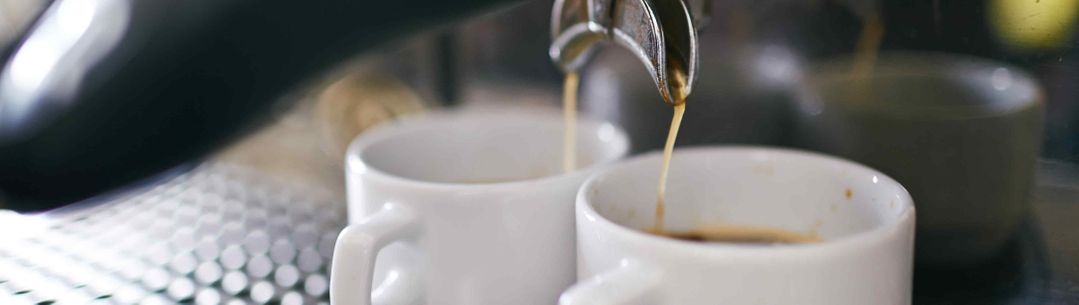 Coffee being prepared by a barista