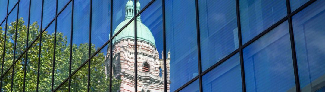 An image of Queens Tower reflected in the glass