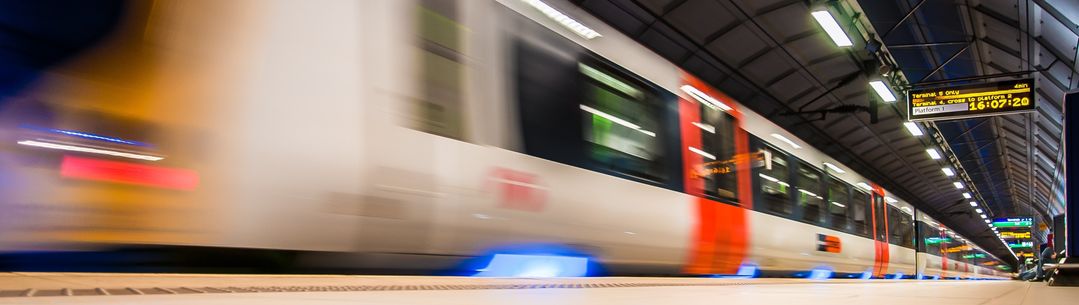 underground station with train passing through