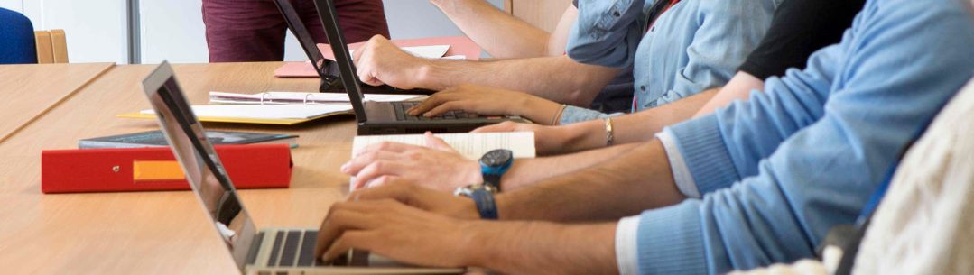 Students writing notes