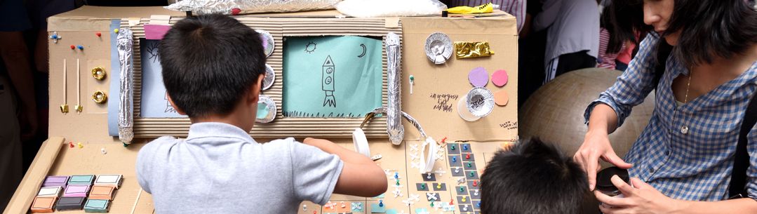 Children interact with an exhibit at the Great Exhibition Road Festival.