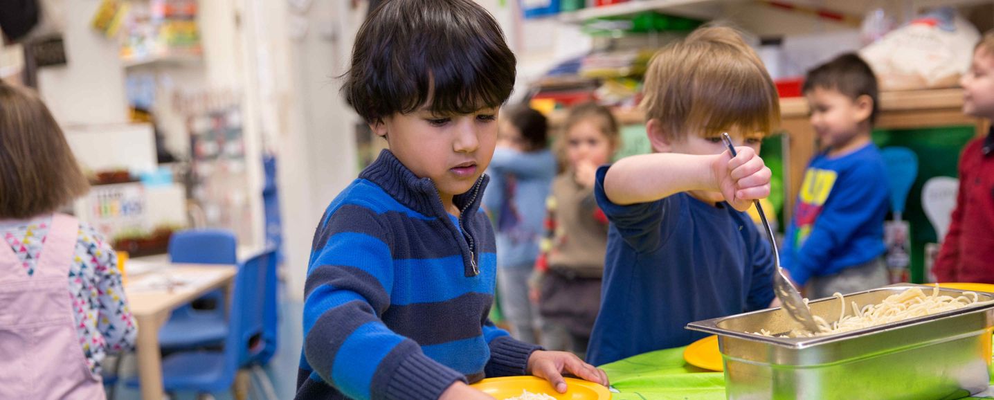 Children tucking into a hearty lunch