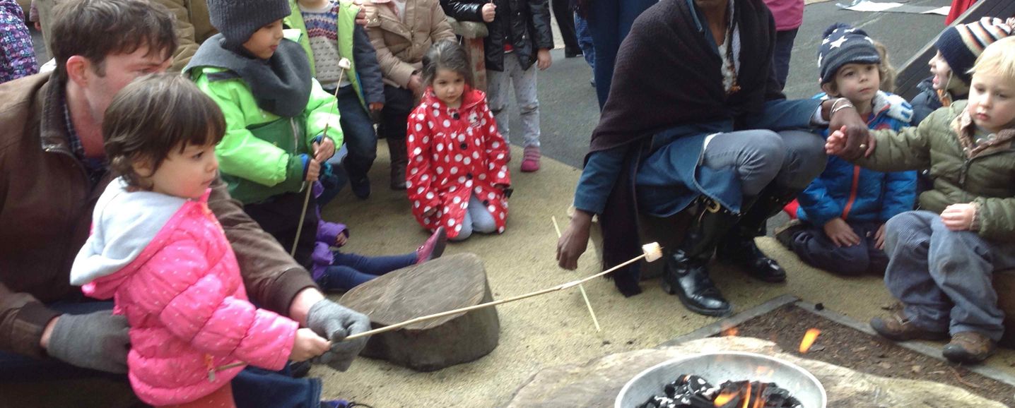 Toasting marshmallows during a camping activity