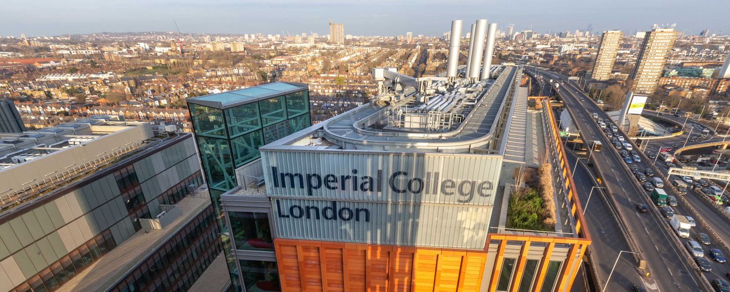 view of the imperial college logo at the top of a building in white city