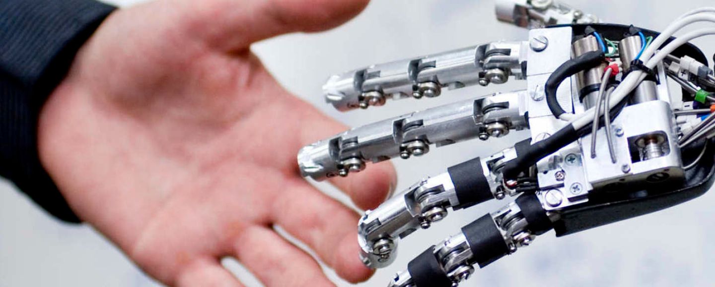 Robot and human hands touching