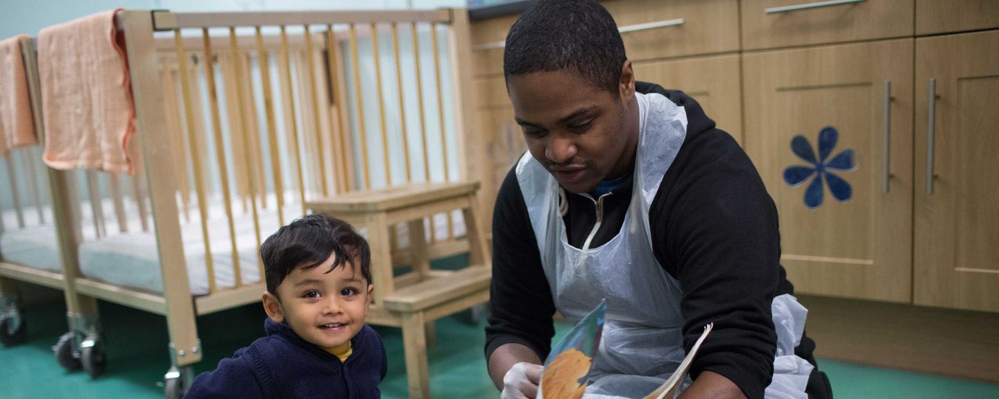 A toddler with caregiver