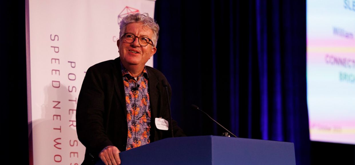 Bill Wisden at lectern giving speech