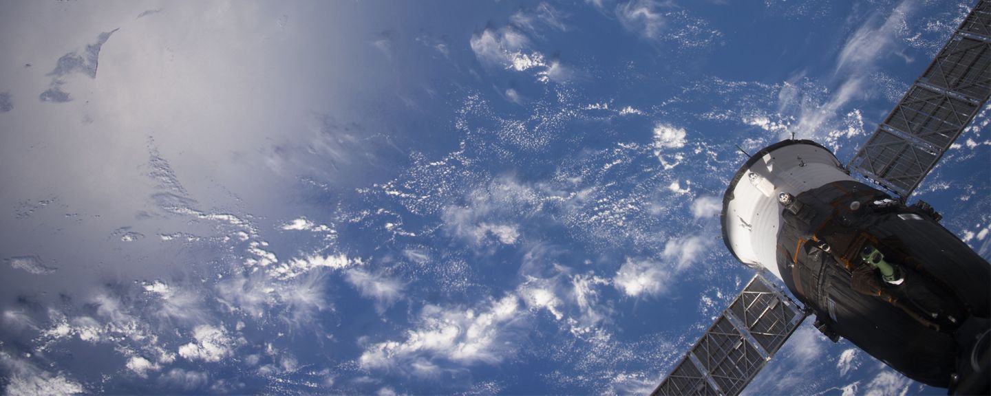 Earth viewed from the International Space Station with part of the space station visible