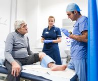 Imperial NHS doctor in appointment with older man